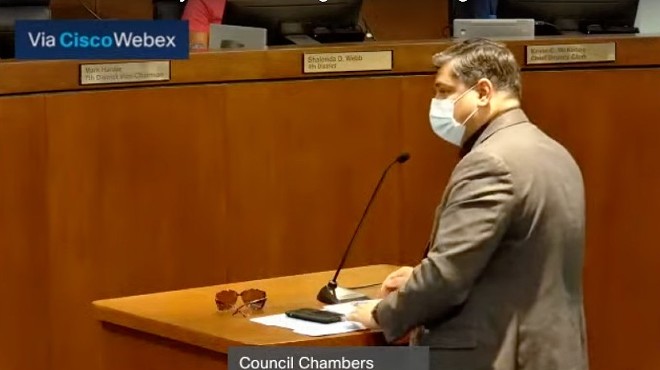 Dr. Faisal Khan speaks to the St. Louis County Council on July 28.