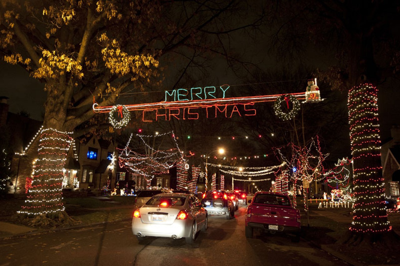 Cars slowly drove down the 6500 block of Murdoch Avenue in South City (transformed into "Candy Cane Lane" for Christmas) on Wednesday night to take in the sights and stop for donations to Camp Happy Day.