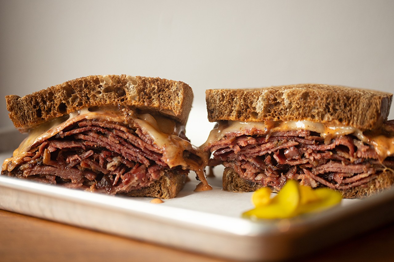 House pastrami sandwich with swiss and special sauce on rye.