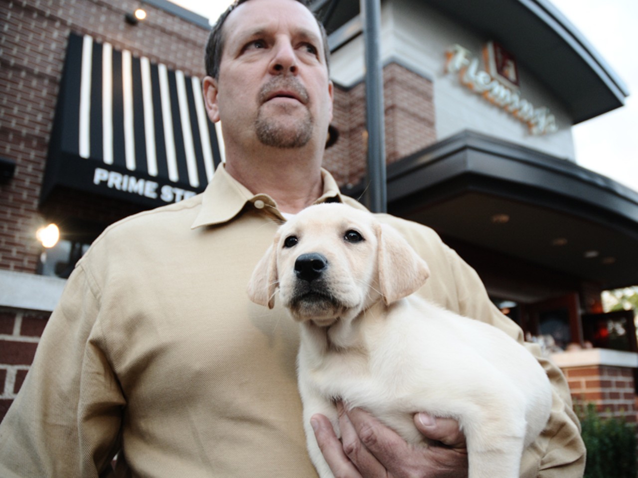 Despite a passing resemblance, this is not Rams head coach Steve Spagnuolo holding an adorable puppy. Although we kind of wish it was.