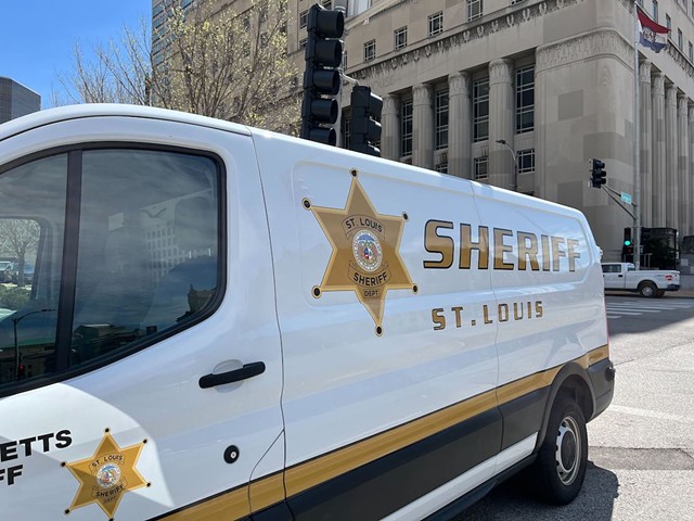 A St. Louis Sheriff's Department van is parked in front of the courthouse downtown.