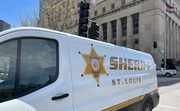 A St. Louis Sheriff's Department van is parked in front of the courthouse downtown.