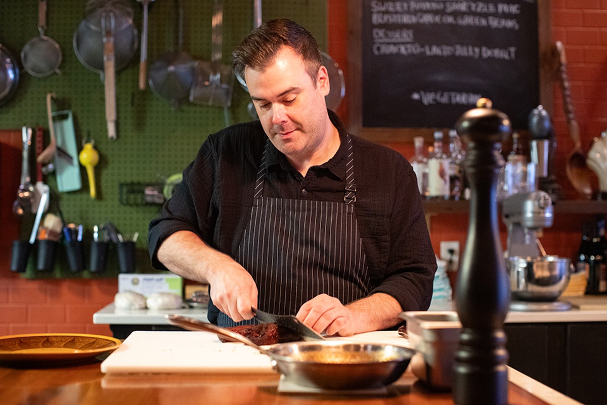 Chef Blake Askew in the open kitchen at Mainlander, which is nominated in the Best New Restaurants category.