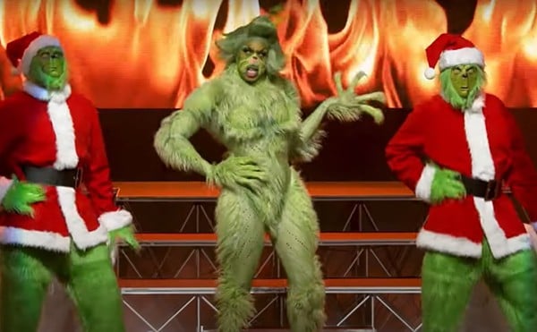 Performers imitate the Grinch at a previous Drag Queen Christmas show.