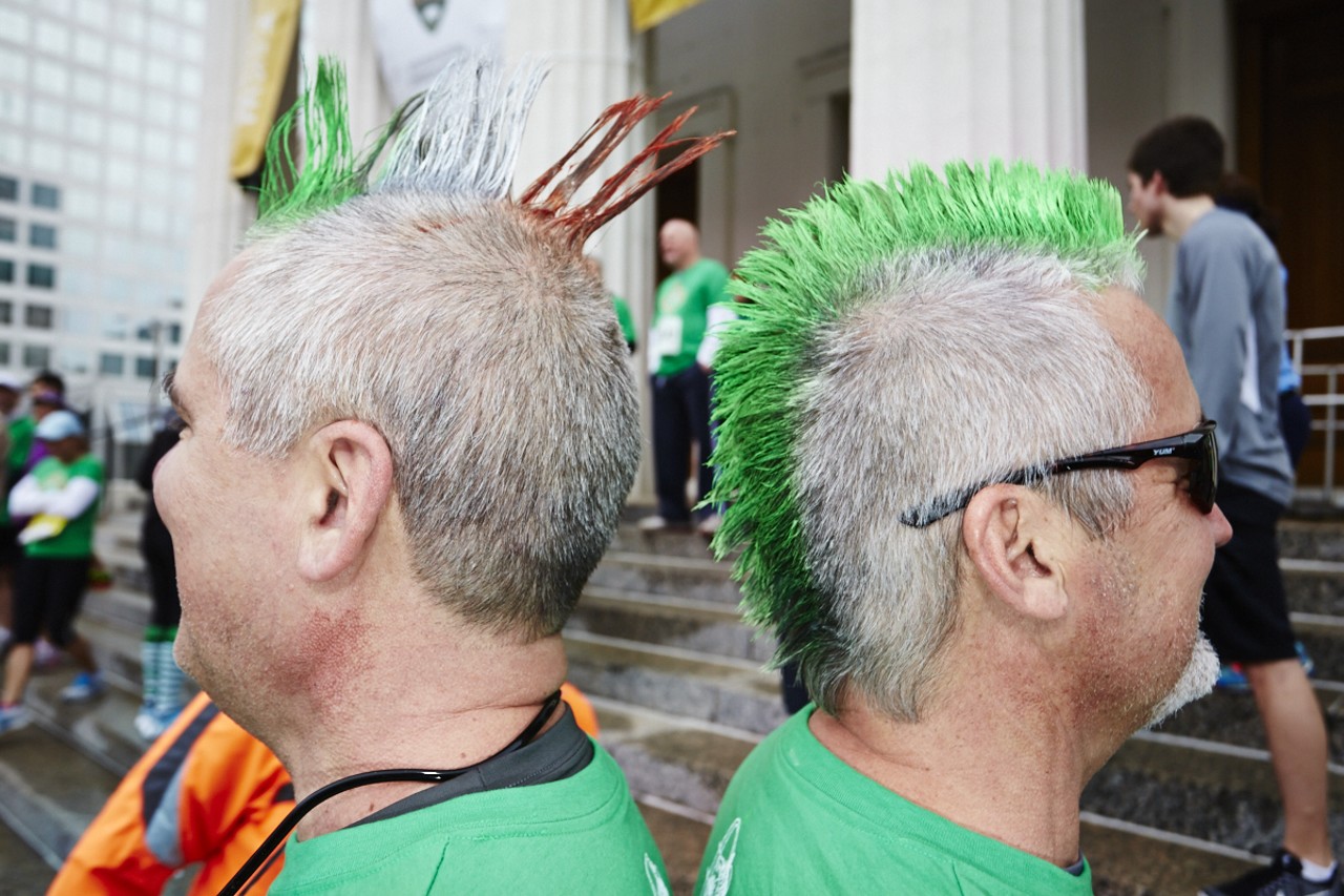 Brothers Tom and Kevin Frank show off their spirit with awesome hairdos at the 37th Annual St. Patrick's Day Parade Run in downtown St. Louis on March 14, 2015.