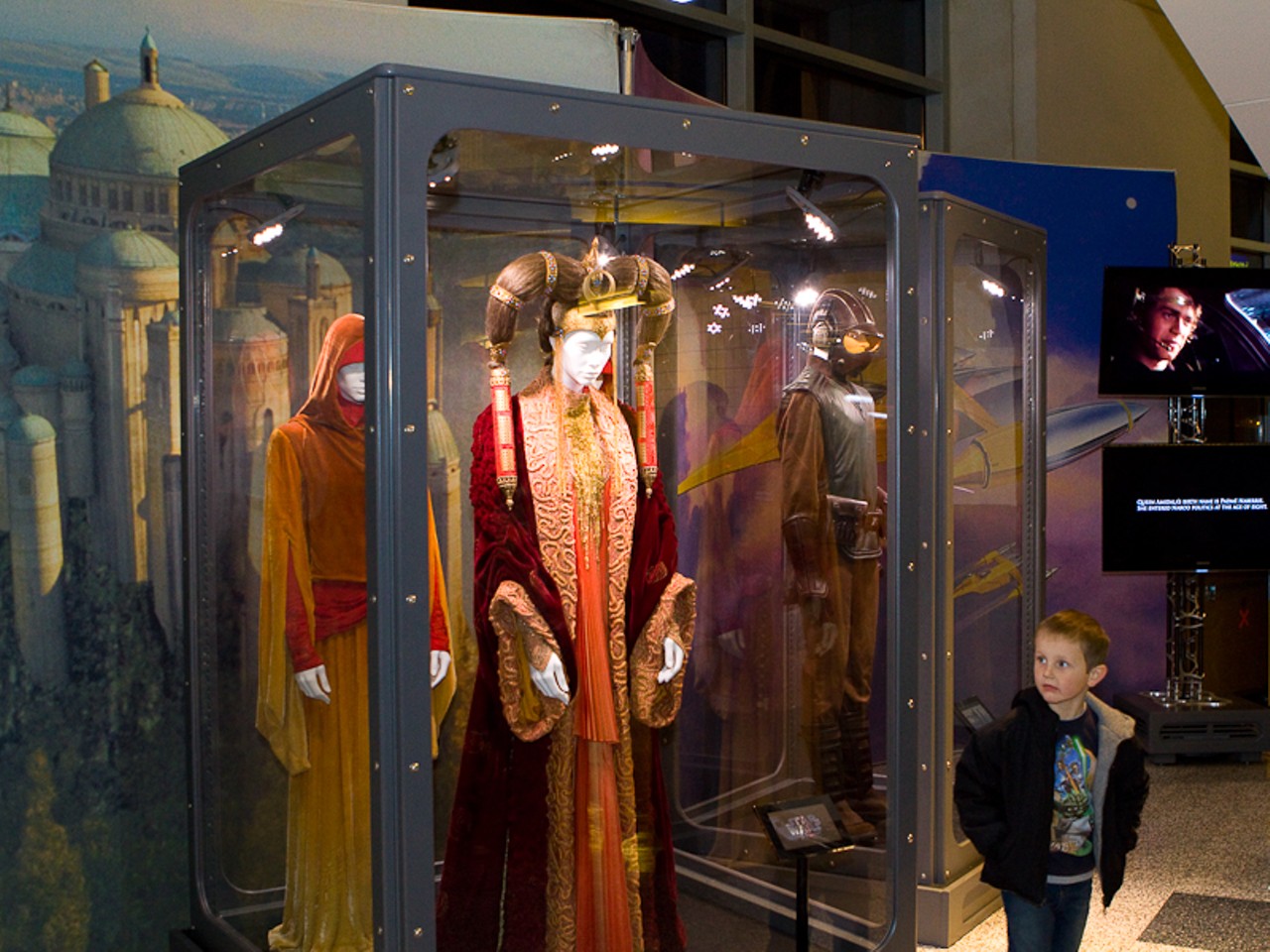A young fan admires Padme's outfit from the second Star Wars movie.