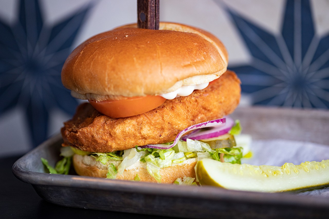 Crispy Chick'n Sandwich with seasoned and house-battered chicken, may, pickles, lettuce, tomato and onion.