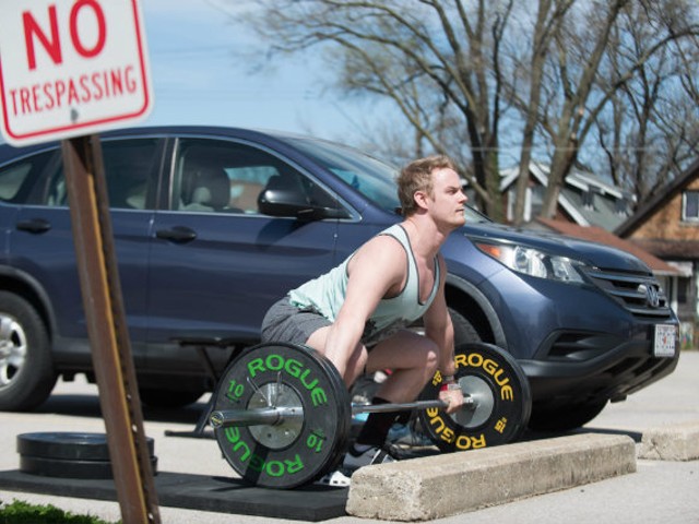 Nick Dondzila can't get to the gym, so he sets up his own in a parking lot.