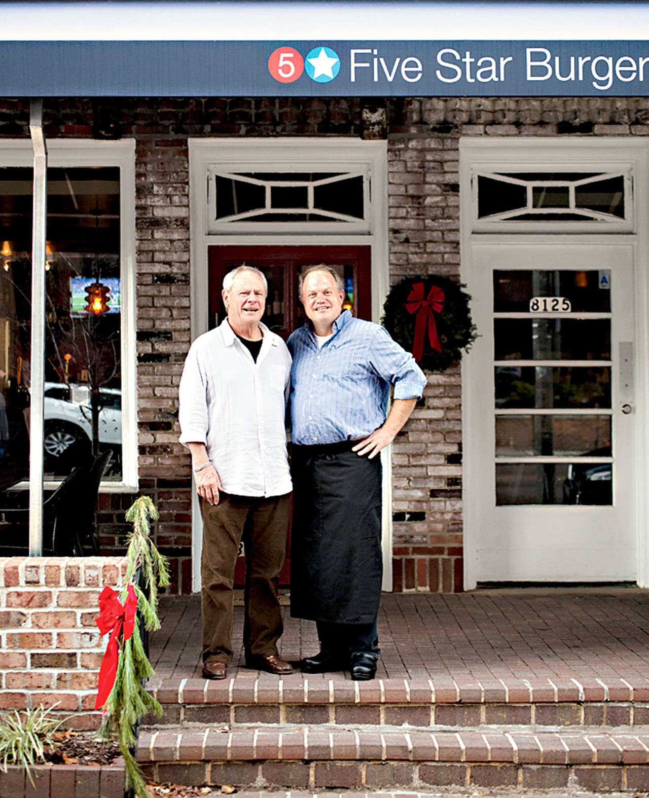The owner of Five Star Burgers in Clayton, Steve Gontram, next to his father, Bob Gontram. Bob owns two locations of Five Star Burgers in the Southwest.