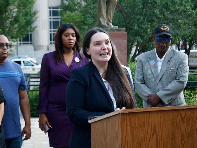 Amy Harms speaks outside the Civil Courts building in St. Louis.