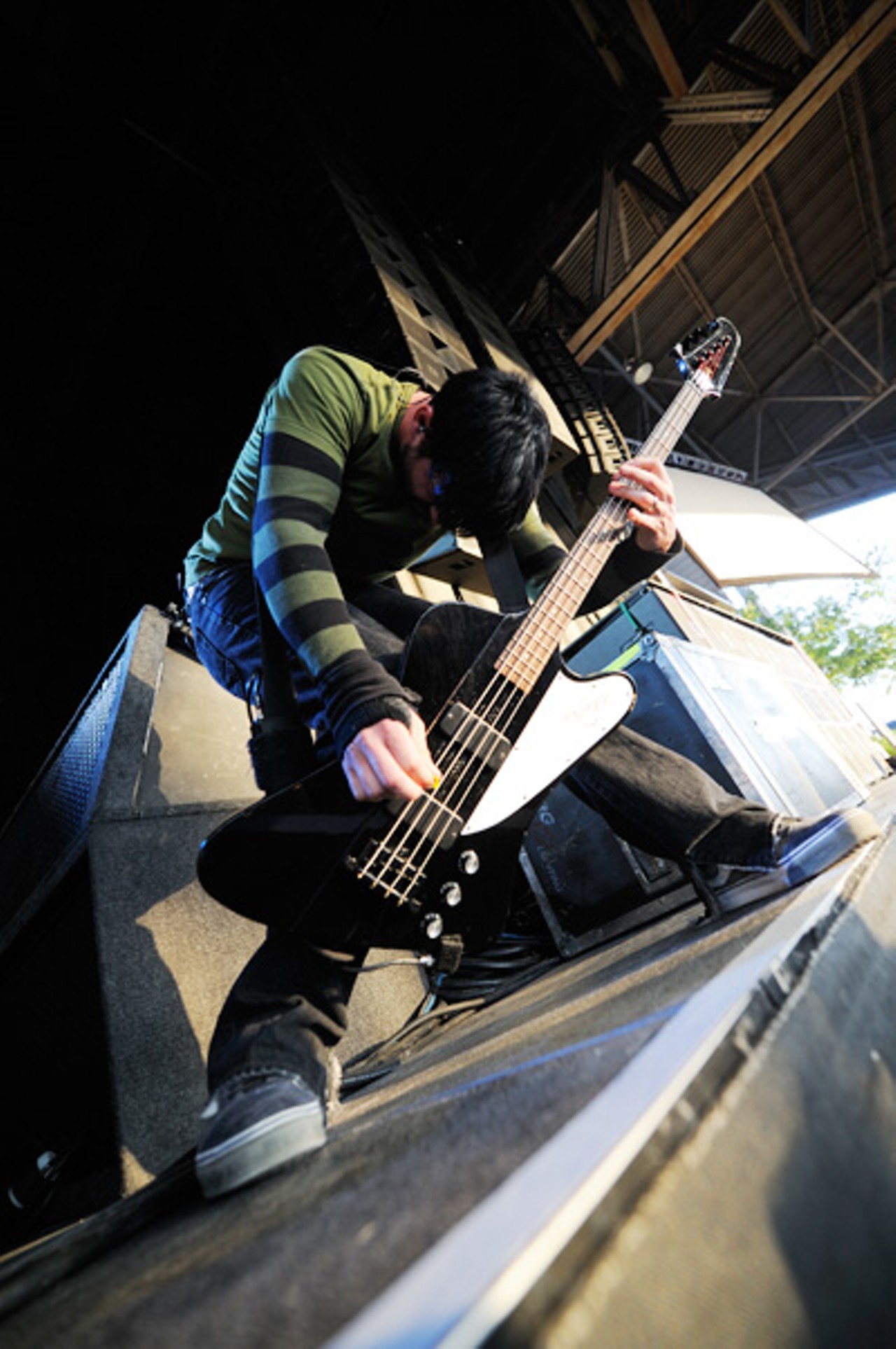 Chevelle's bassist Dean Bernardini, pummeling his instrument at the edge of the amphitheater's stag.e