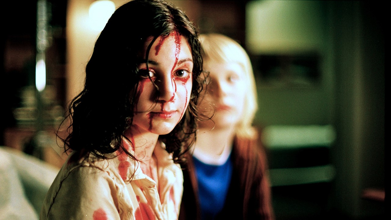 10. Let the Right One In (2008)
A fragile, anxious boy, 12-year-old Oskar is regularly bullied by his stronger classmates but never strikes back. The lonely boy's wish for a friend seems to come true when he meets Eli, also 12, who moves in next door to him with her father. A pale, serious young girl, she only comes out at night and doesn't seem affected by the freezing temperatures. Coinciding with Eli's arrival is a series of inexplicable disappearances and murders. One man is found tied to a tree, another frozen in the lake, a woman bitten in the neck. Blood seems to be the common denominator -- and for an introverted boy like Oskar, who is fascinated by gruesome stories, it doesn't take long before he figures out that Eli is a vampire. But by now a subtle romance has blossomed between Oskar and Eli, and she gives him the strength to fight back against his aggressors. Oskar becomes increasingly aware of the tragic, inhuman dimension of Eli's plight, but cannot bring himself to forsake her. Frozen forever in a 12-year-old's body, with all the burgeoning feelings and confused emotions of a young adolescent, Eli knows that she can only continue to live if she keeps on moving. But when Oskar faces his darkest hour, Eli returns to defend him the only way she can.