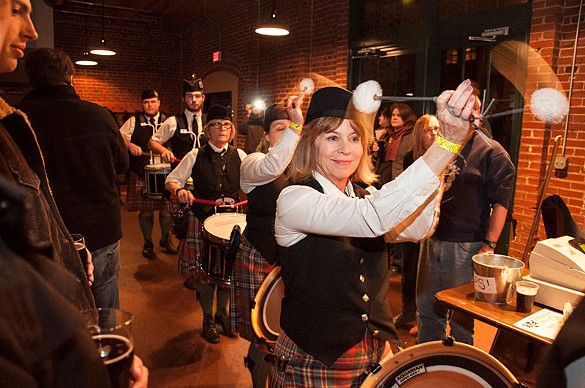 The Celtic drumline parades through the crowd at Schlafly Tap Room.