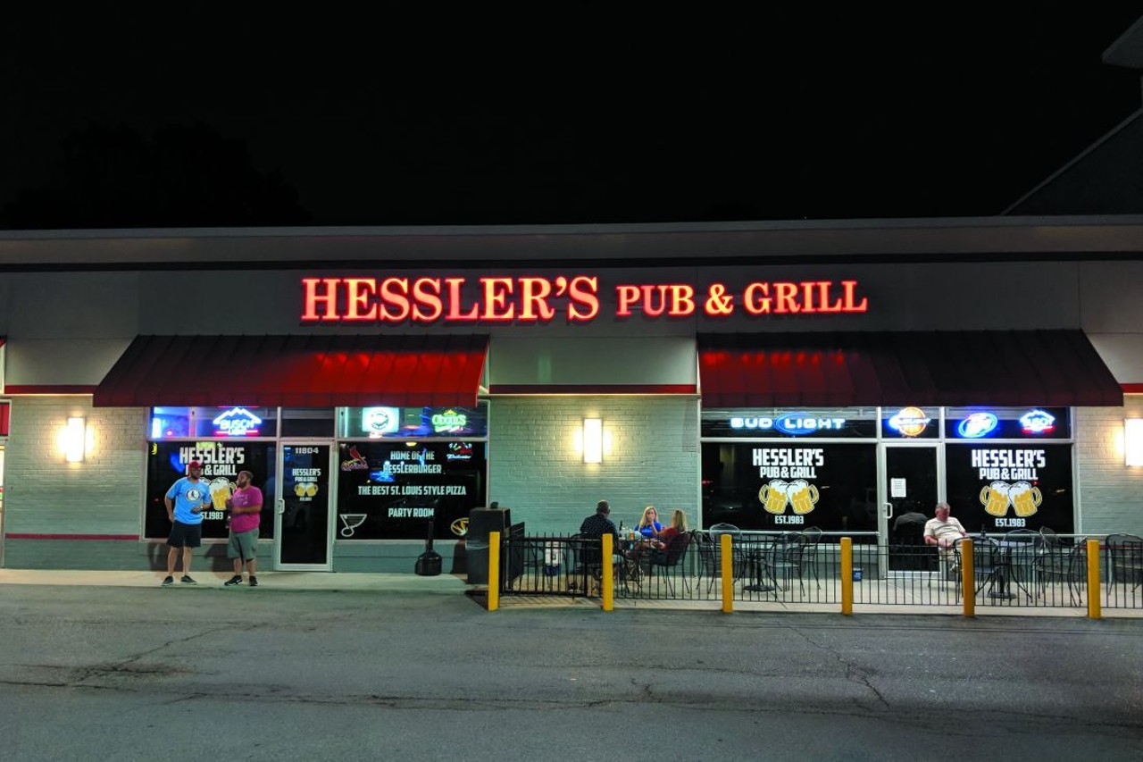 Hessler's Pub & Grill
In south county, the traditional neighborhood bar found its home in the strip malls dotting the landscape of suburban sprawl. Hessler's Pub & Grill (11804 Tesson Ferry Road, 314-842-4050) staked out its spot in 1983 and hasn't let go since. Even with a change of ownership in 2009, the menu remains deep on choices, from barroom staples to a dish of 25 fried mini tacos (sharing optional). Many hungry eyes, however, alight on the house burger and never move past it ... and that works too. On the weekends, Hessler's boasts south county's longest-running karaoke scene, and with its neon bar lights and wood-paneled walls, the place feels like your dad's comfortably retro '70s basement, only with the addition of a full kitchen and happy hour with $2 bottles and $5 appetizers. Even better: Every month Hessler's spreads some joy and pulls an all-day happy hour. That's the kind of community spirit that should keep the place open at least another 35 years.
Photo credit: Danny Wicentowski