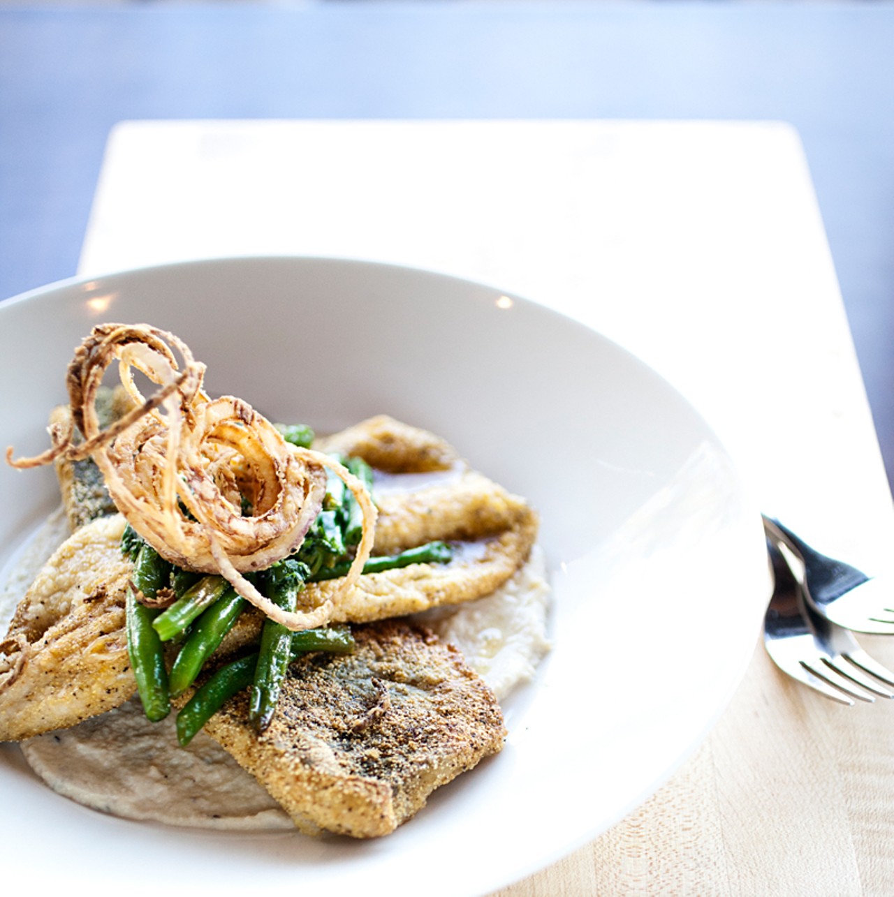 The Missouri trout at the Block is cornmeal-encrusted with roasted cauliflower, green beans, crispy onions and herb butter.