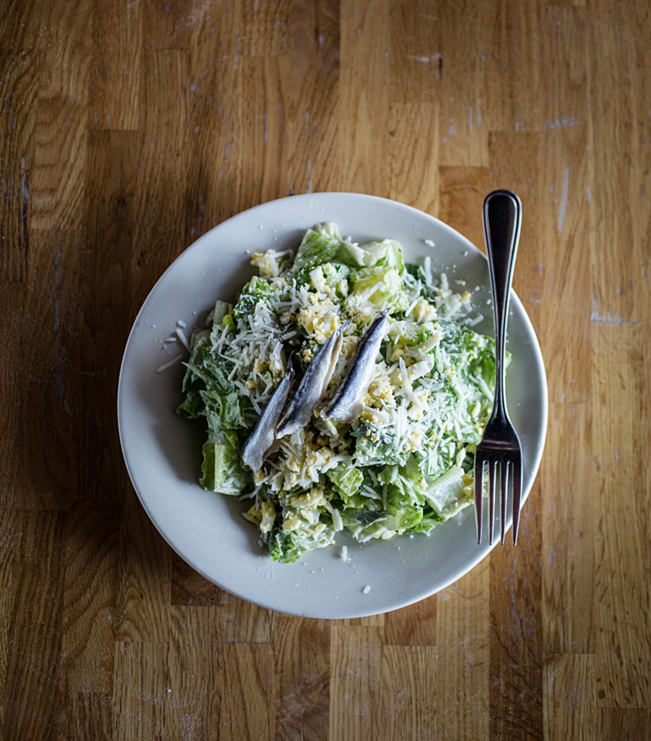 The Caesar salad is made with egg and parmigiano, and it has the additional option of anchovy.
