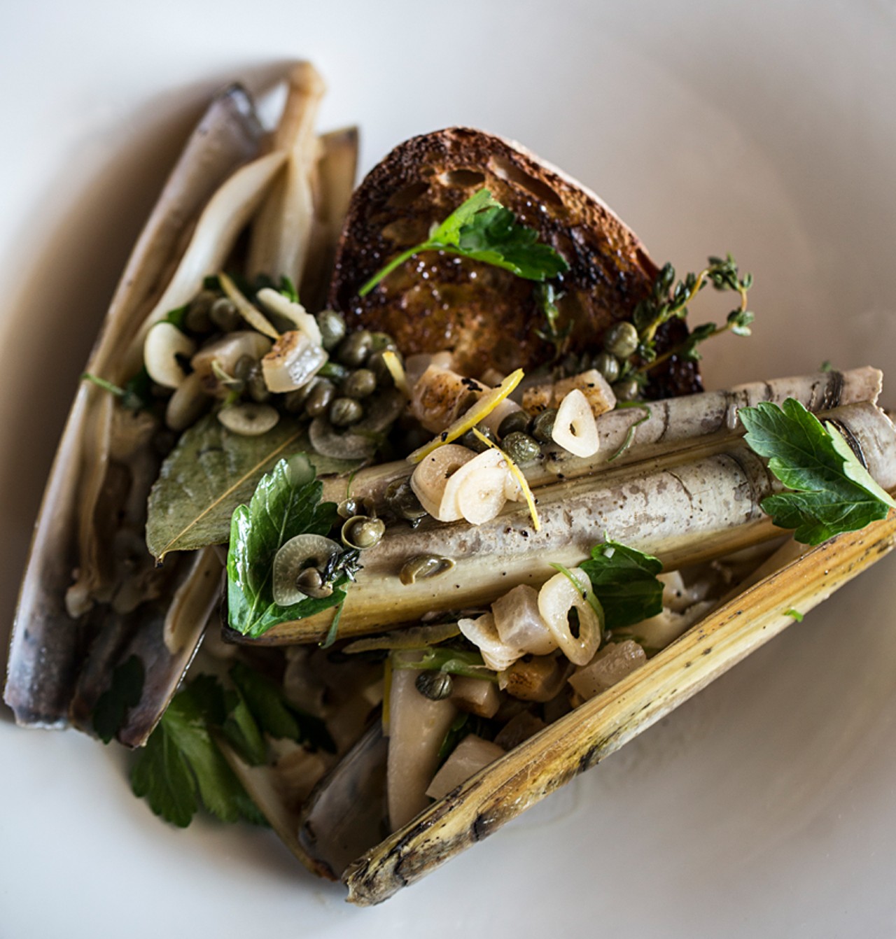 The "Razor Clams al Vino," with capers, garlic, bay leaf and thyme. It's served with housemade sourdough.