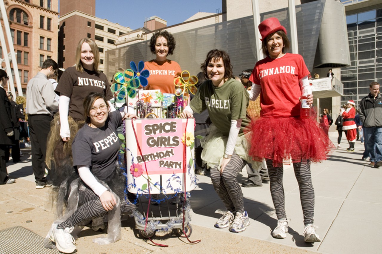 Members of the Spice Girls pose with their shopping cart before the race.