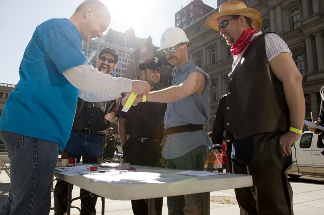 Partnership for Downtown St. Louis employee Matt Schindler, of St. Louis, signs in the Villiage Idiots before the start of the Idiotarod race in downtown on Saturday, March 6. A total of 36 teams participated during the two-day event.