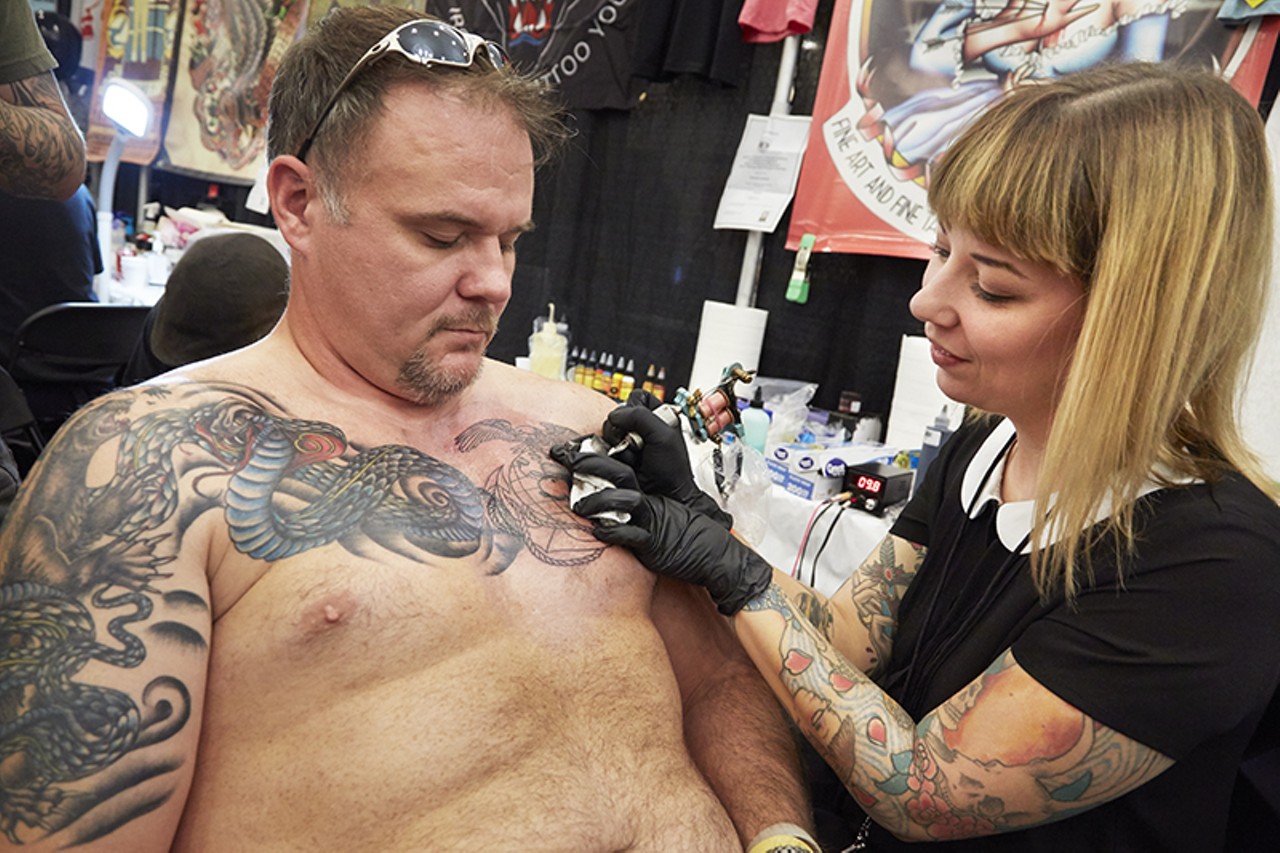 Artist Angie Meuth from Edwardsville, Illinois, gives Scott Wolosky new ink that honors the Marines.