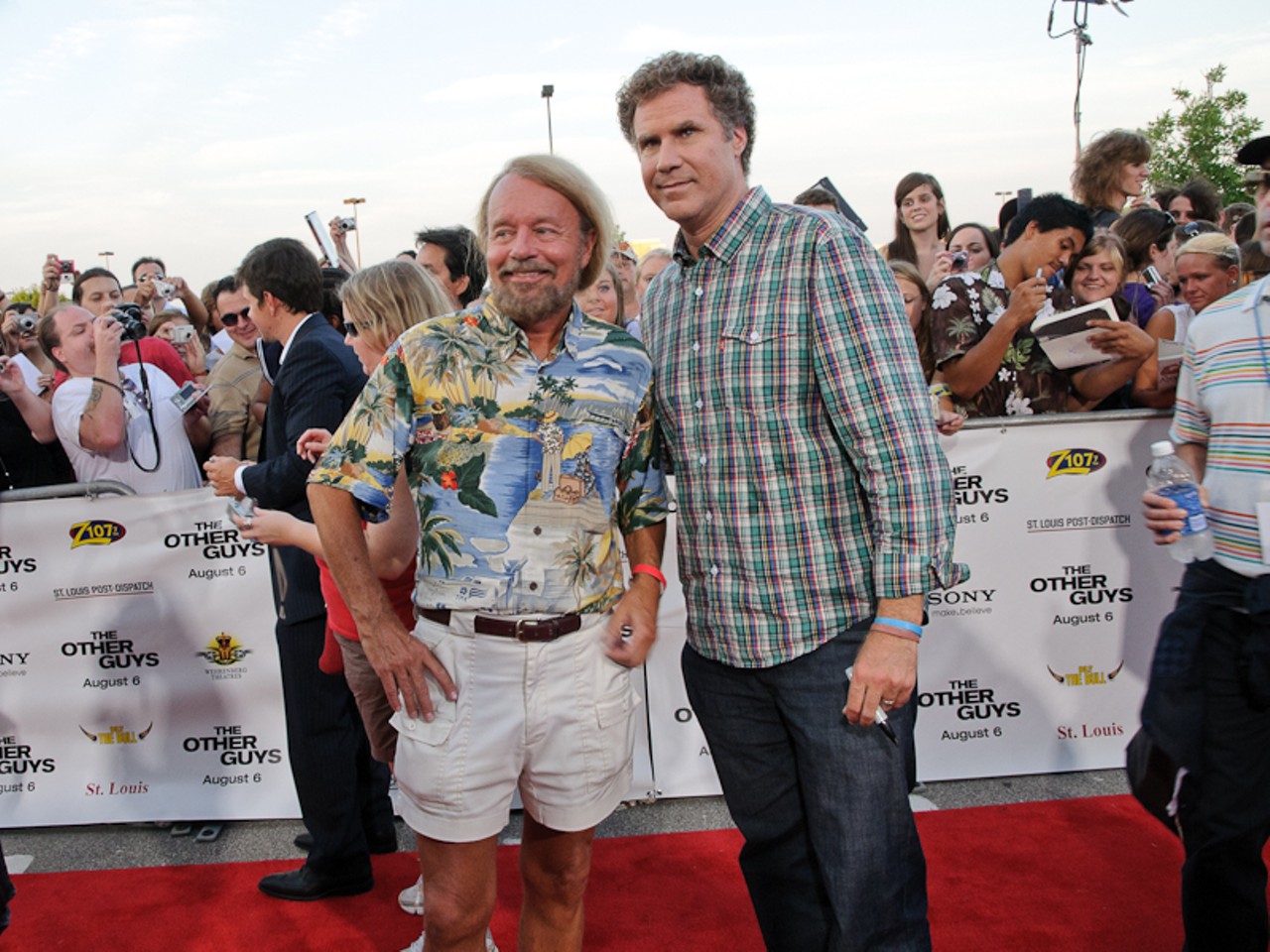Joe Edwards and Will Ferrell pose for photos on the red carpet.