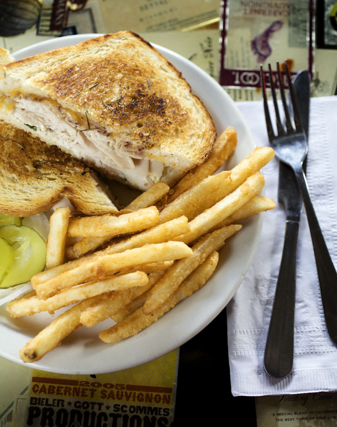 The Herb Roasted Turkey sandwich is served on sourdough bread with artichoke garlic spread, Swiss and Colby Jack cheeses. All the sandwiches come with fries.