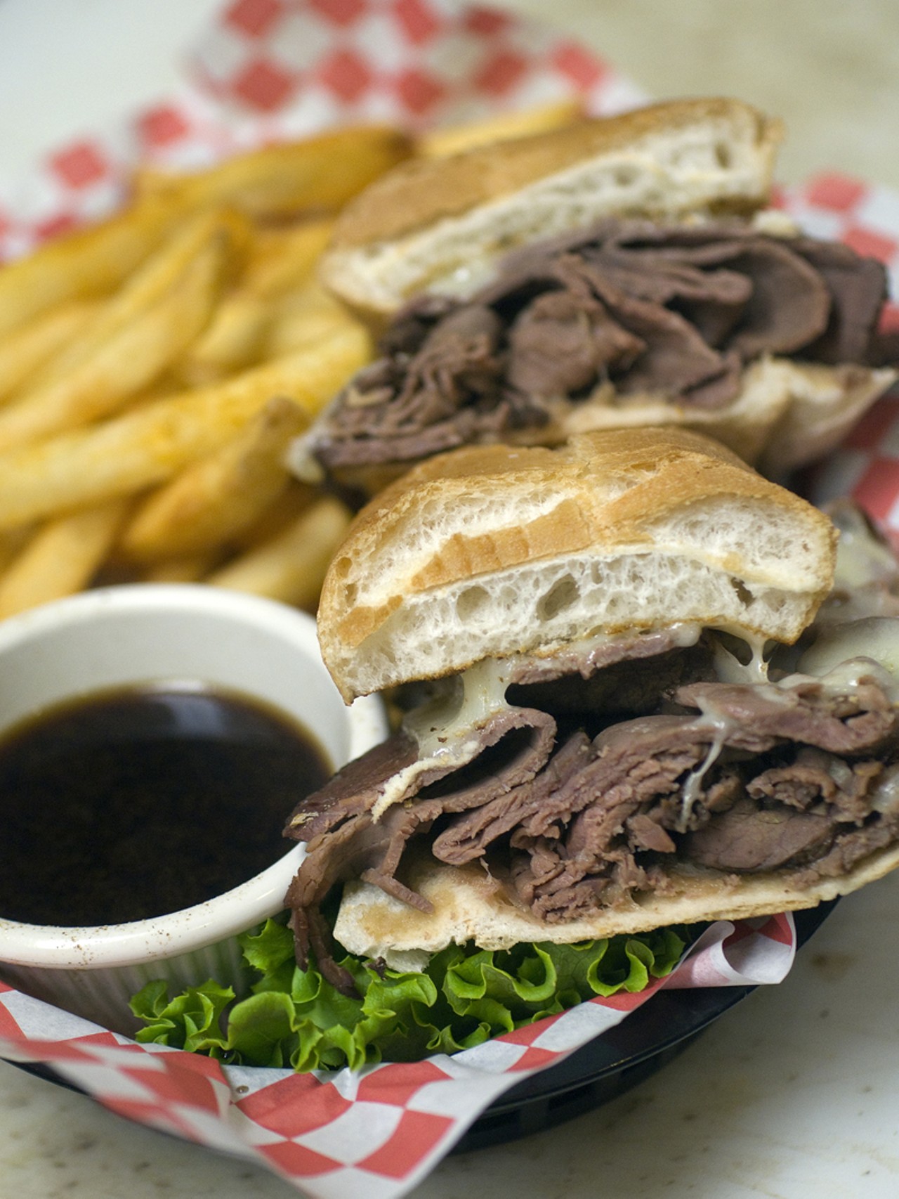 The French Dip is thinly sliced roast beef dipped in au jus and topped with melted Swiss cheese.