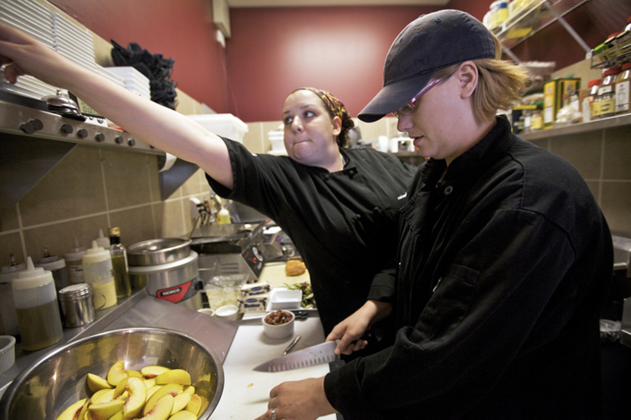 Executive Chef Cassandra Vires, in the background, working in rather tight quarters with cook Christina Bollinger.