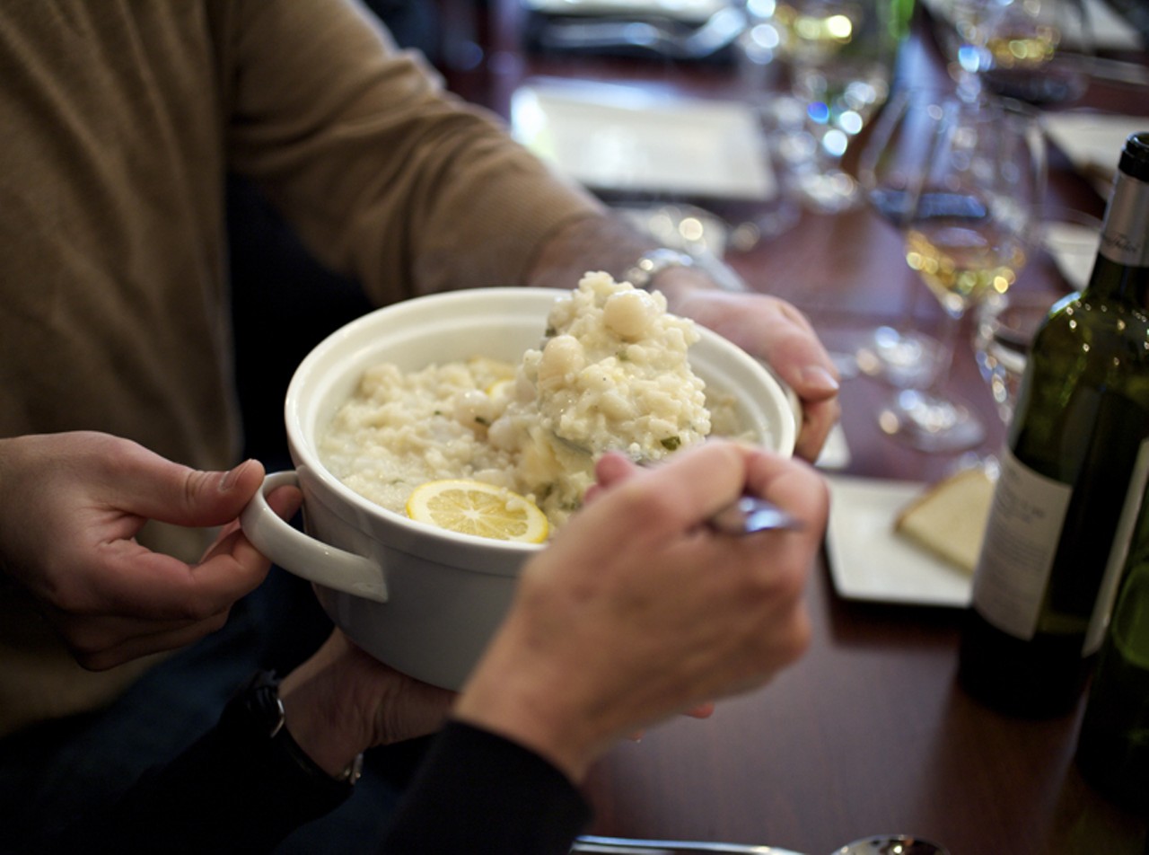 For the family-style supper club's first course: a bay scallop risotto with Meyer lemon.