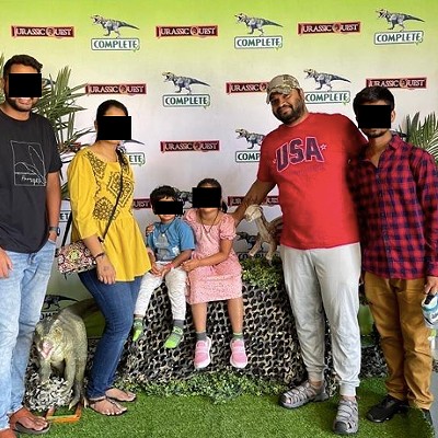Venkatesh Sattaru, second to right, standing next to the alleged 20-year-old victim in the case (wearing the red and blue button down) and four other individuals.