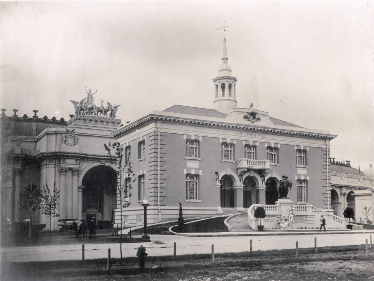 1904 WORLD'S FAIR TOWN HALL. Horizontal, black and white image showing the Town Hall, with the Civic Pride Monument between staircases, in the Model City area. Photo probably by Jessie Tarbox Beals. The Palace of Education is in the background.
Find out more about this photo at MoHistory.org.