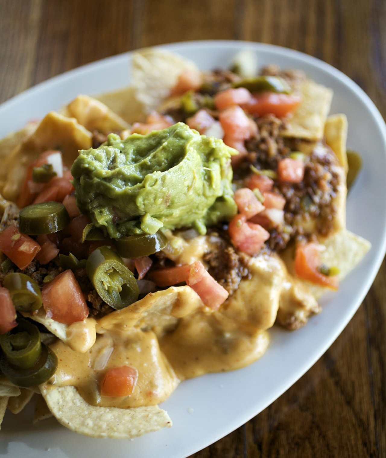 Chorizo Nachos - Spicy Chorizo, queso blanco, pico de gallo, guacamole, jalapenos and house-made chips. Also available on both the regular and late night menus.