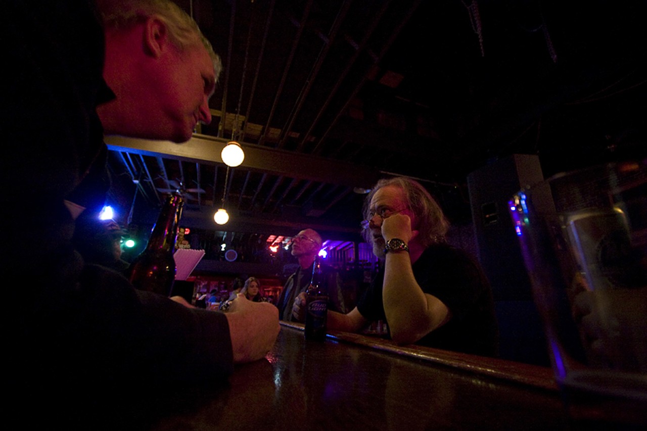 Tommy Ramone takes a break at the bar during the intermission.