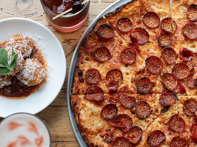 A selection of items from O+O Pizza: arancini, cocktails and the OG pepperoni pizza.