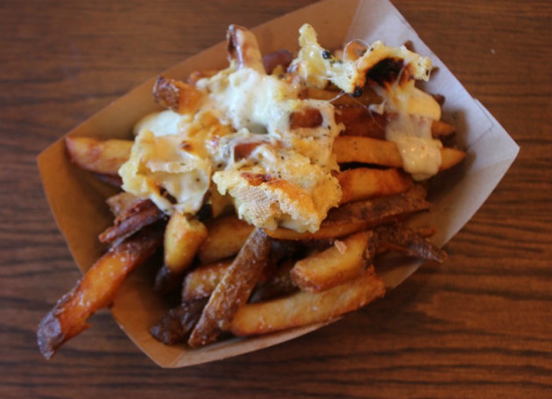 Housemade fries are topped with raclette cheese. - CHERYL BAEHR