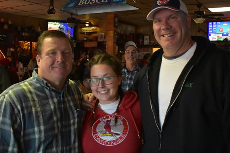 Ken Mitchell, Sarah Stippec, a photo-bombing regular and Kent "Biggin" Cox drinking at the bar on Wednesday. - PHOTO BY DANIEL HILL