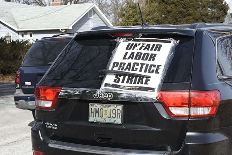 A car parked outside of Christian Care home with a sign that reads, "unfair labor practice strike". - Megan Anthony