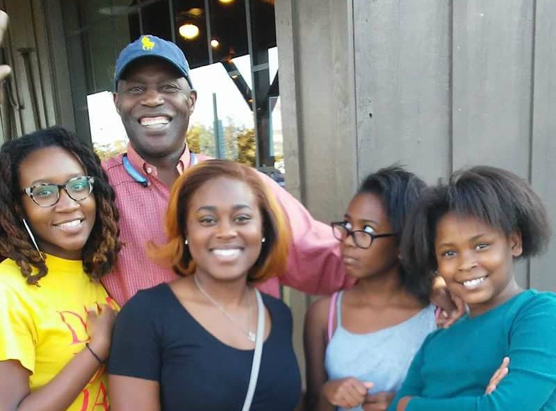 Charles Lewis with his granddaughters. Lewis is now suing the city. - COURTESY OF CHARLES LEWIS