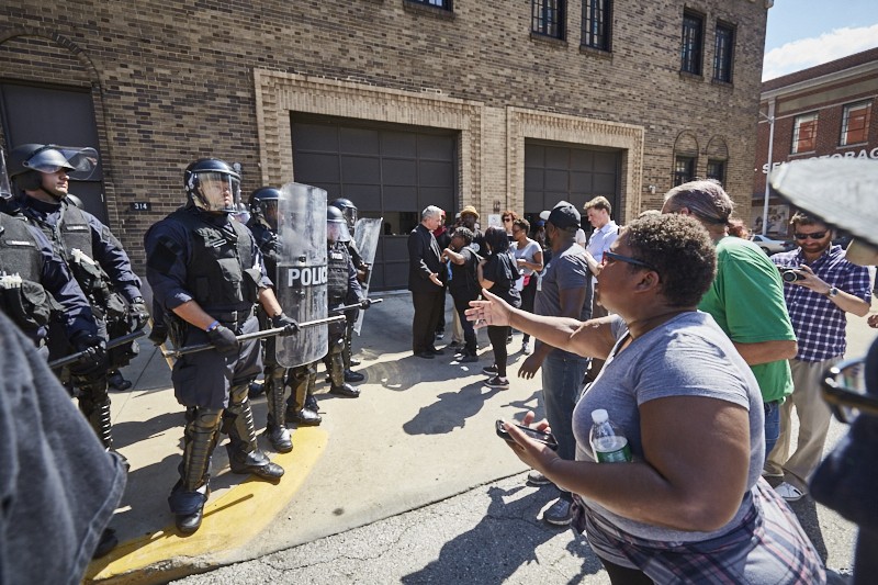 St. Louis Police face off with protesters. Wouldn't this look better with bubble wands? - THEO WELLING