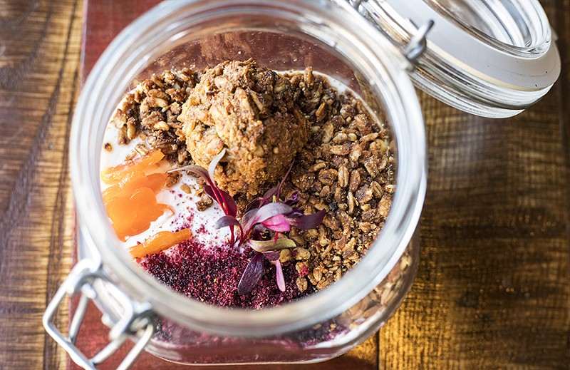 Housemade yogurt with dried apricots, granola, huckleberry powder, carrot cookie and pawpaw-apricot puree. - MABEL SUEN