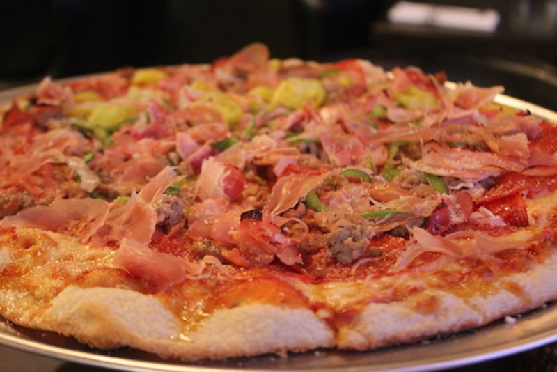"El Padrino" is chock-full of ham, salsiccia, prosciutto, peppers, red onion and roasted garlic. - SARAH FENSKE