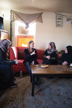 Jessica Bueler, center left, works with Alifa Alahmed, Iman Alkrad and Najlaa Alsaadi to plan an upcoming Supper Club event. - SARA BANNOURA