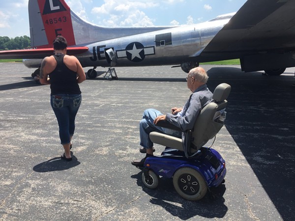 General Ron Youngs and his granddaughter Alison Youngs board the B-17. - photo by Jaime Lees