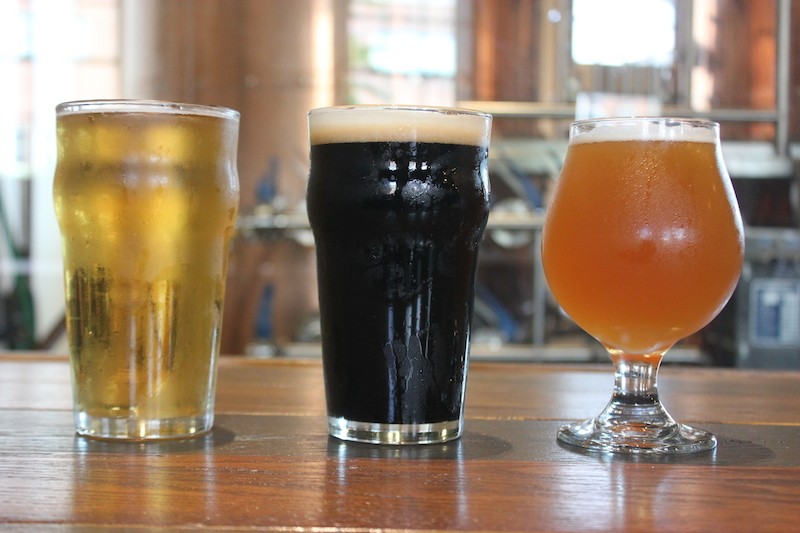 Three of Twisted Roots' current roster of offerings: The Canookie, a lite American lager; the Irish Flu, an Irish extra stout; and Kali, a mango-saturated pale ale. - SARAH FENSKE