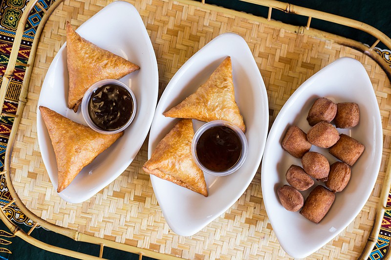 Sumbusas and mandazi, or African doughnuts, show the kitchen's skill around a fryer. - MABEL SUEN