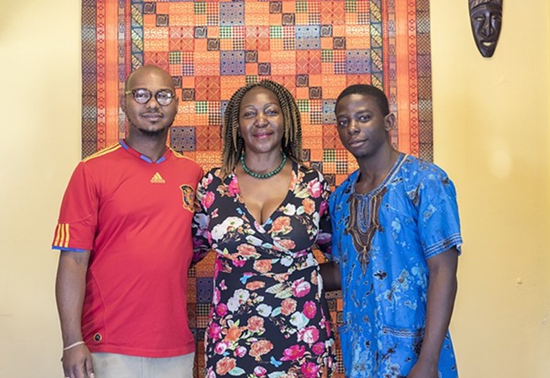 Chef Christine Mukulu Sseremba, with sons George Knudsen and Majesty Mukulu, is worried about what a massive redevelopment project on Olive will mean for her business. - MABEL SUEN