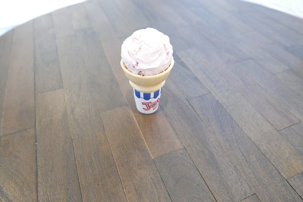 Strawberry ice cream in a sugar cone. - DESI ISAACSON
