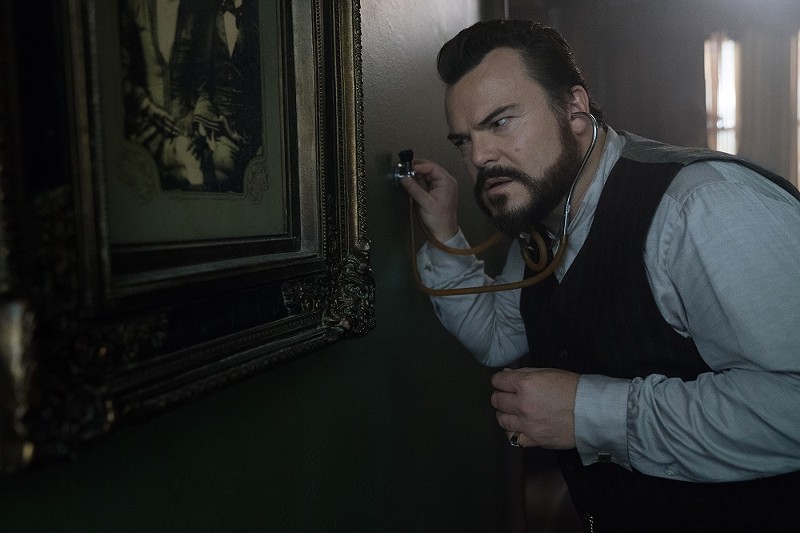 Uncle Jonathan (Jack Black) listens for the tell-tale sound of doomsday. - (C)  STORYTELLER DISTRIBUTION CO., LLC