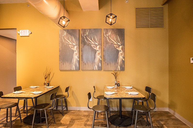 The main dining room features antler-themed decor. - MABEL SUEN