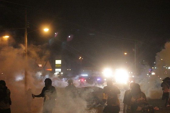 Police fired both tear gas and smoke grenades at protesters Sunday night. - DANNY WICENTOWSKI